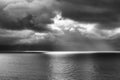 Seascape with Clouds and Beam of Light One Boat Black and White Royalty Free Stock Photo