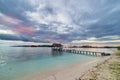 Seascape and cloudscape with jetty at dusk