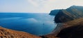 Seascape with coastal volcanic hills and blue wavy water in La Gomera, Canary Islands, Spain.