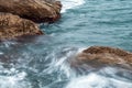 Seascape of the Crimean coast. Waves break into beautiful splashes against rocks. Royalty Free Stock Photo