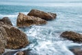 Seascape of the Crimean coast. Waves break into beautiful splashes against rocks. Royalty Free Stock Photo