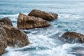 Seascape of the Crimean coast. Waves break into beautiful splashes against rocks. Royalty Free Stock Photo