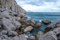 Seascape of the Crimean coast. Waves break into beautiful splashes against rocks. Royalty Free Stock Photo