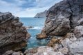 Seascape of the Crimean coast. Waves break into beautiful splashes against rocks. Royalty Free Stock Photo