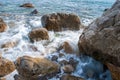 Seascape of the Crimean coast. Waves break into beautiful splashes against rocks. Royalty Free Stock Photo