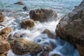 Seascape of the Crimean coast. Waves break into beautiful splashes against rocks. Royalty Free Stock Photo