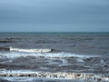 Seascape with deep blue ocean and surf breaking on the beach Royalty Free Stock Photo