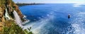 Seascape of Duden Waterfall with a boat in the sea near it Antalya, Turkey. Colorful panorama with Turkish landmarks on a sunny Royalty Free Stock Photo