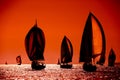 Sailing boats silhouette in the high sea on orange sunset Royalty Free Stock Photo