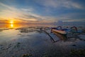 Seascape. Fisherman boat jukung. Traditional fishing boat at the beach during sunrise. Colorful sky. Amazing water reflection.