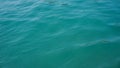 Seascape of the glowing blue green Sea of from a boat looking with small waves and ripples calm sea surface