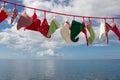Seascape of hats and socks hanging - blue christmas background w