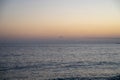 Seascape with a horizon bathed in sunset light