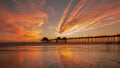 Huntington Beach Pier at Sunset. Brilliant Orange Winter Sunset. Royalty Free Stock Photo