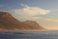 Seascape, landscape, scenic view of Hout Bay in Cape Town, South Africa at sunset. Blue ocean and sea with mountains in Royalty Free Stock Photo