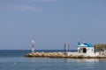 Seascape. The lighthouse at the church in the town of Faliraki in Greece on the island of Rhodes Royalty Free Stock Photo