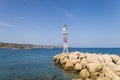 Seascape. The lighthouse at the church in the town of Faliraki in Greece on the island of Rhodes Royalty Free Stock Photo