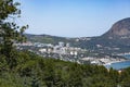 Seascape with a lonely mountain and houses at the foot of the mountains. Black Sea Royalty Free Stock Photo