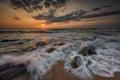 Seascape with long exposed waves and round rocks