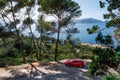 Seascape of Mediterranean Sea with red car Volvo, Mallorca, Spain