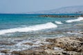 Seascape of the Mediterranean Sea with waves of the turquoise sea on the volcanic coast of Cyprus Royalty Free Stock Photo