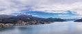 Seascape mediterraneum town in Kotor harbor with mountains and houses under clouds panorama view Royalty Free Stock Photo