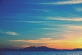 Seascape with mountains at sunset Royalty Free Stock Photo