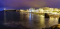 Seascape at night in Biarritz France in long photographic exposure. Beach and buildings at night in summer. France Royalty Free Stock Photo