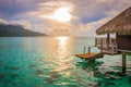 Seascape and overwater bungalow at sunset in Moorea. Royalty Free Stock Photo