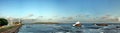 wide panorama exotic ocean city coast with big wave and rock