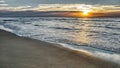 Seascape panorama of sea sunset with soft waves and clouds