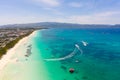 Seascape in the Philippines in sunny weather, view from above. Transparent sea and tourist boats near the island of Boracay Royalty Free Stock Photo