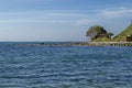 Seascape of pier for fishing in the Black Sea with larus, small house and tree at coast, ancient city Nessebar Royalty Free Stock Photo