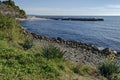 Seascape of pier for fishing boat with coastal garden in the Black Sea and small beach near ancient city Nessebar Royalty Free Stock Photo