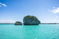 Seascape of Pines Island, new caledonia: turquoise lagoon, typical rocks, blue sky Royalty Free Stock Photo