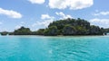 Seascape of Pines Island, new caledonia: turquoise lagoon, typical rocks, blue sky Royalty Free Stock Photo