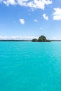 Seascape of Pines Island, new caledonia: turquoise lagoon, typical rocks, blue sky Royalty Free Stock Photo