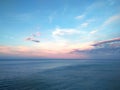 Seascape pink sky horizon water ocean cloudy