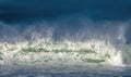 Seascape. Powerful ocean wave on the surface of the ocean. Wave breaks on a shallow bank. Royalty Free Stock Photo