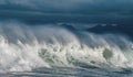 Seascape. Powerful ocean wave on the surface of the ocean. Wave breaks on a shallow bank. Stormy weather, clouds sky. Royalty Free Stock Photo