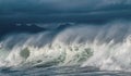 Seascape. Powerful ocean wave on the surface of the ocean. Wave breaks on a shallow bank. Stormy weather, clouds sky. Royalty Free Stock Photo