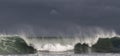 Seascape. Powerful ocean wave on the surface of the ocean. Wave breaks on a shallow bank. Stormy weather, stormy clouds sky Royalty Free Stock Photo