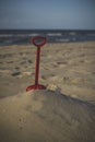 seascape with red plastic sea shovel Royalty Free Stock Photo