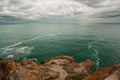 Seascape with rocks and clouds