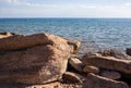 Seascape with rocks and large stones. Sea shore Royalty Free Stock Photo