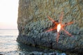 Seascape with a rockthe sunset in the hole of the rock Royalty Free Stock Photo