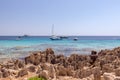 Seascape with rocky beach and emerald sea with yachts. Ibiza island. Balearic Islands, Spain Royalty Free Stock Photo