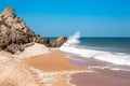 Seascape. Rocky seashore with a wave on a summer sunny day Royalty Free Stock Photo
