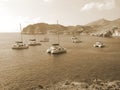 Seascape with sailboat, catamarans, sailing yachts near Red Beach. Santorini, Greece.