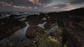 Seascape scene with beautiful morning light on rocky beach during low tide in Freshwater West, Pembrokeshire, South Wales,UK Royalty Free Stock Photo